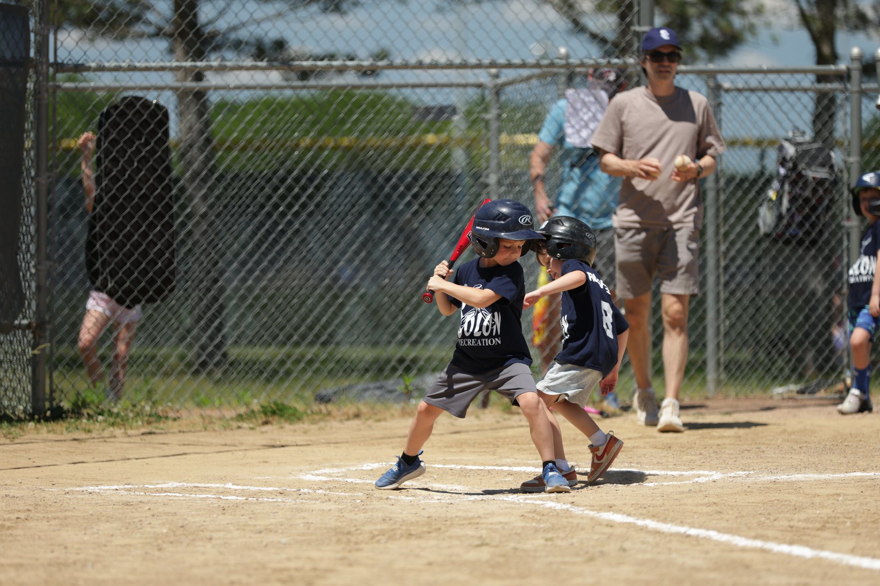 Youth baseball player preparing a throw.