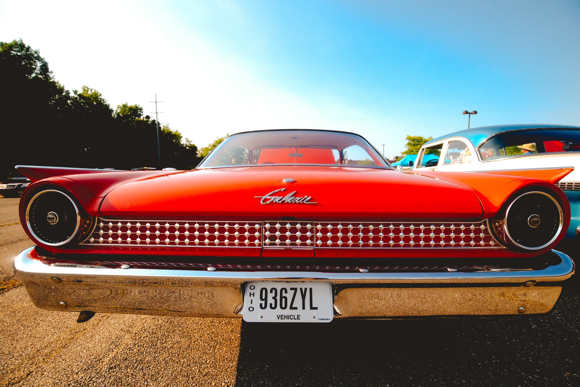 Red classic Edsel photographed straight on at a car show.