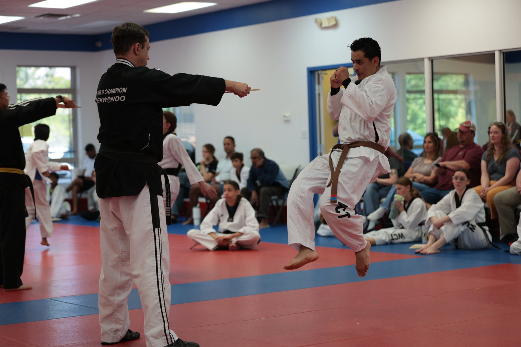 Martial arts test in front of spectators.